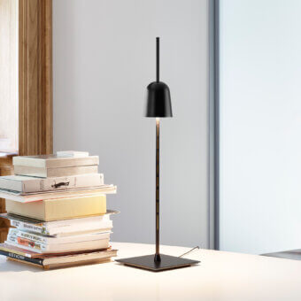 Innovative Luceplan Ascent table lamp crafted with lathed anodized aluminum, black technopolymer and painted steel in a matte black finish