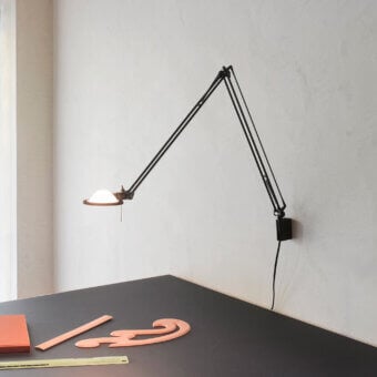 Superior Luceplan Berenice wall lamp crafted in metal with a matte black finish delivers directed light with fluid positioning