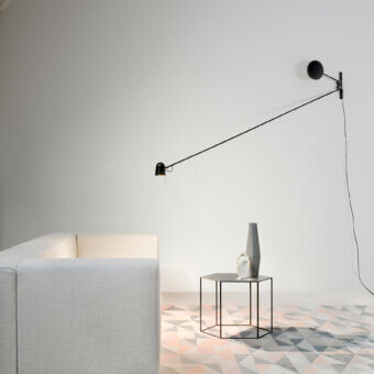 Superior Luceplan Counterbalance wall lamp in matte black painted steel with a sleek aluminum head and sculptural form