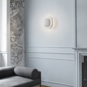 Elegant Luceplan Luthien wall lamp crafted in technopolymer with a refined white aluminum finish