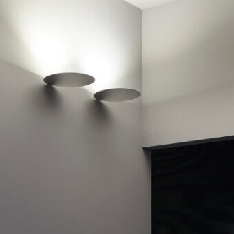 Distinguished Luceplan Millimetro wall lamp crafted in polished metal with a matte gray finish delivers impactful illumination