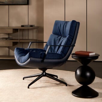 Exclusive Mascheroni Cabrio lounge chair upholstered in plush blue nubuck with a vegetable leather shell and dark metal swivel base