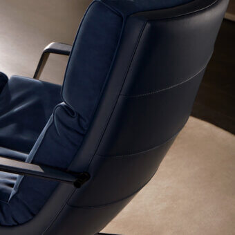 Distinguished Mascheroni Cabrio lounge chair in deep blue nubuck and vegetable leather with quilted stitching and matte black metal base