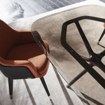 Captivating Mascheroni Gemma Base armchair upholstered in reddish-brown textile with a satin dark-toned wood shell and metal accents