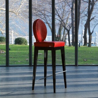 Exceptional Mascheroni Martini bar stool with vibrant red leather upholstery and a shaped birch frame