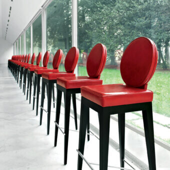 Superior Mascheroni Martini bar stool with red ox leather seat and organically curved shaped birch frame crafted in Italy
