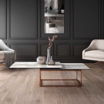 Superior Naos Amerigo coffee table with ceramic top displaying white and grey veining and a satin sheen copper-toned steel base
