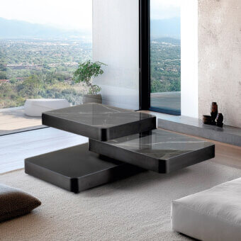 Superior Naos Aurum coffee table with dark gray ceramic top and painted frame exhibiting graceful layered form