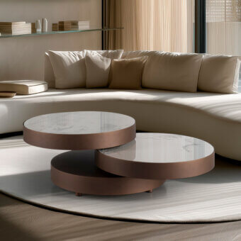 Distinguished Naos Aurum round coffee table with extendable layered ceramic surfaces and warm muted bronze painted frame