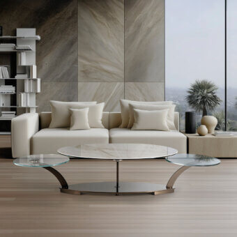Superior Naos Cocoon coffee table with sculpted form and synchronized opening mechanism in polished silver-toned painted steel and glass tops