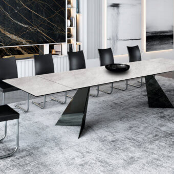 Elegant Naos Ingents table with light gray stone tabletop and dark metal base exhibiting a matte finish