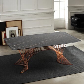 Distinctive Naos Latour extendable dining table with dark grey marbled glass or ceramic and warm copper-toned painted metal base