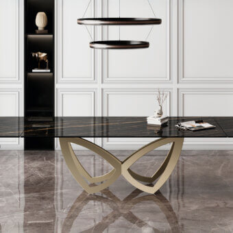 Distinguished Naos Par Par table with a dramatic black ceramic top and sculptural satin-finish metal base in a unique butterfly silhouette