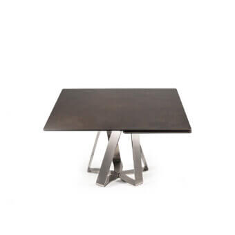 Distinguished Naos turning table with a dark ceramic tabletop and intersecting matte metal legs embodying a contemporary aesthetic