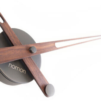 Distinctive Nomon Axioma wall clock crafted in wood with dark brown hands and a contrasting gray plate with a satin finish