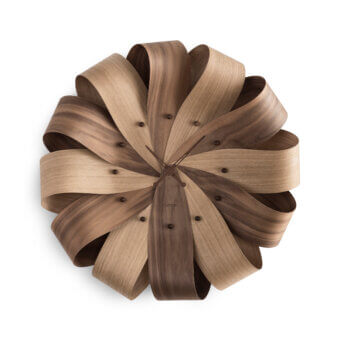 Luxury Nomon Brisa Wall Clock crafted in natural oak showcasing a delicate floral silhouette with a satin finish