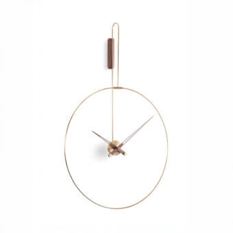 Elegant Nomon Daro wall clock with curved metal frame and delicate open design in muted gold tone with satin sheen