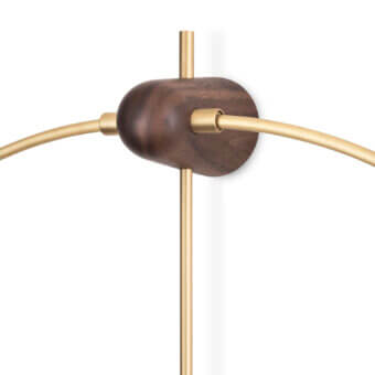 Lavish Nomon Micro Anda wall clock with a bright golden metallic ring and warm walnut wood hands in satin and matte finish