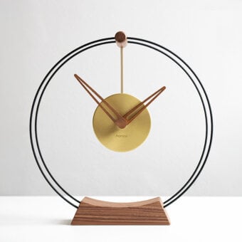 Superior Nomon Mini Aire table clock with double black fiberglass rings, warm walnut components and delicate brass details in satin finish
