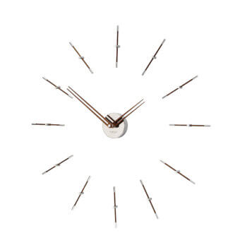 Elegant Nomon Mini Merlín wall clock with twelve slender metallic time signals and brushed silver finish