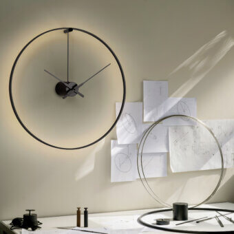 Superior Nomon Ombra clock lamp crafted in black anodized aluminum with a smooth matte finish