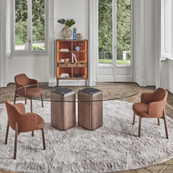 Distinguished Porada Bay table with transparent glass top and sculptural Canaletta walnut bases, finished with subtly greystained ash core
