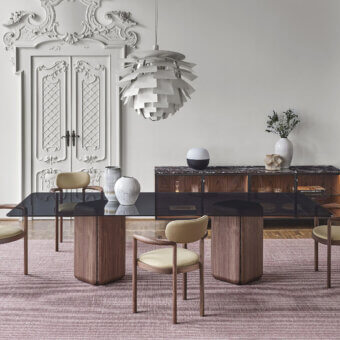 Distinguished Porada Bay rectangular table with a glass tabletop and Canaletta walnut base finished in a satin sheen