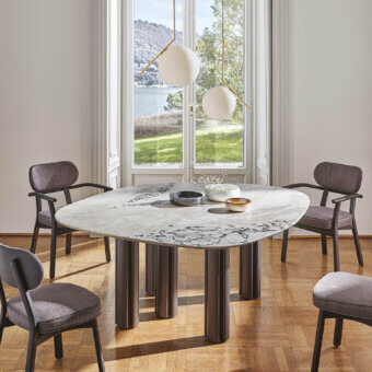 Distinguished Porada Berry table with flowing marble and satin finish dark toned wood columns