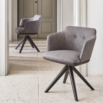 Elegant Porada Celine armchair with textured medium gray textile upholstery and Canaletta Walnut base crafted in Italy