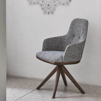Remarkable Porada Connie swiveling chair with textured gray textile upholstery and satin-finish medium-brown wood base crafted in Italy