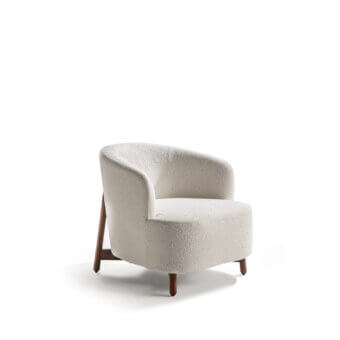 Sophisticated Porada Copine armchair with enveloping form and textured bouclé fabric upholstery in a creamy off-white hue with satin-finish wood