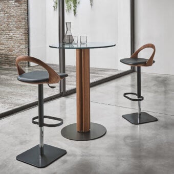 Elegant Porada Ester stool crafted from wood with a natural finish and dark textile upholstery with a matte black metal base