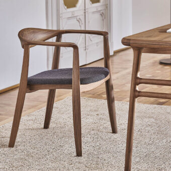 Superior Porada Frida armchair with sculpted solid canaletto walnut frame and dark gray upholstered seat in satin finish
