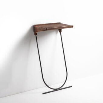 Refined Porada Maori console built with a solid canaletta walnut top and pewter grey metal frame with a satin sheen