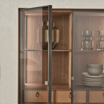 Elegant Matics cabinet built in wood with a satin finish and dark metal framed glass doors