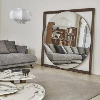 Exceptional Porada Odino mirror with geometric design in medium-brown ash wood and circular reflective surface