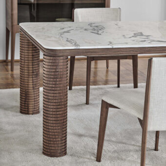 Distinguished Porada Sansiro table with cool marble and warm canaletto walnut crafted in a satin finish