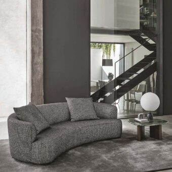 Distinguished Porada Yves sofa upholstered in subtly textured grayscale fabric with a solid Canaletta walnut base