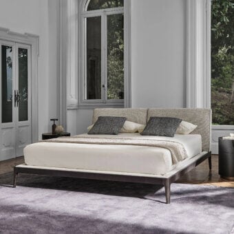 Refined Porada Ziggy Bed Soft with a solid canaletto walnut frame and fully upholstered light-colored headboard in matte finish