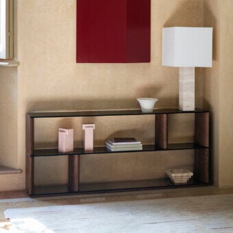 Harmonious Potocco Pages bookshelf with sinuous solid ash wood uprights and transparent bronze mirrored glass shelves in a satin finish