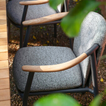 Sophisticated Potocco Solar armchair with muted gray technical fabric and warm solid teak armrests, built with powder-coated aluminum