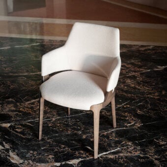 Lavish Potocco Velis Hug armchair with textured neutral beige textile upholstery and light-toned wood frame
