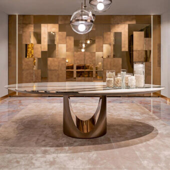 Exceptional Visionnaire Cameron table crafted in steel with bronze finish and cool grey marble tabletop