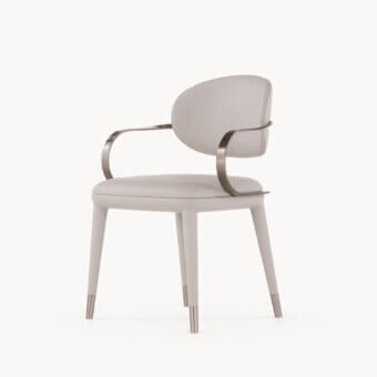 Elegant Visionnaire Elixir armchair with curved matte beige leather upholstery and polished satin twisted metal support