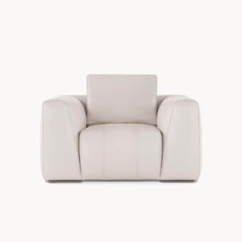 Sumptuous Visionnaire Loving F lounge chair upholstered in neutral beige leather with a smooth textured finish