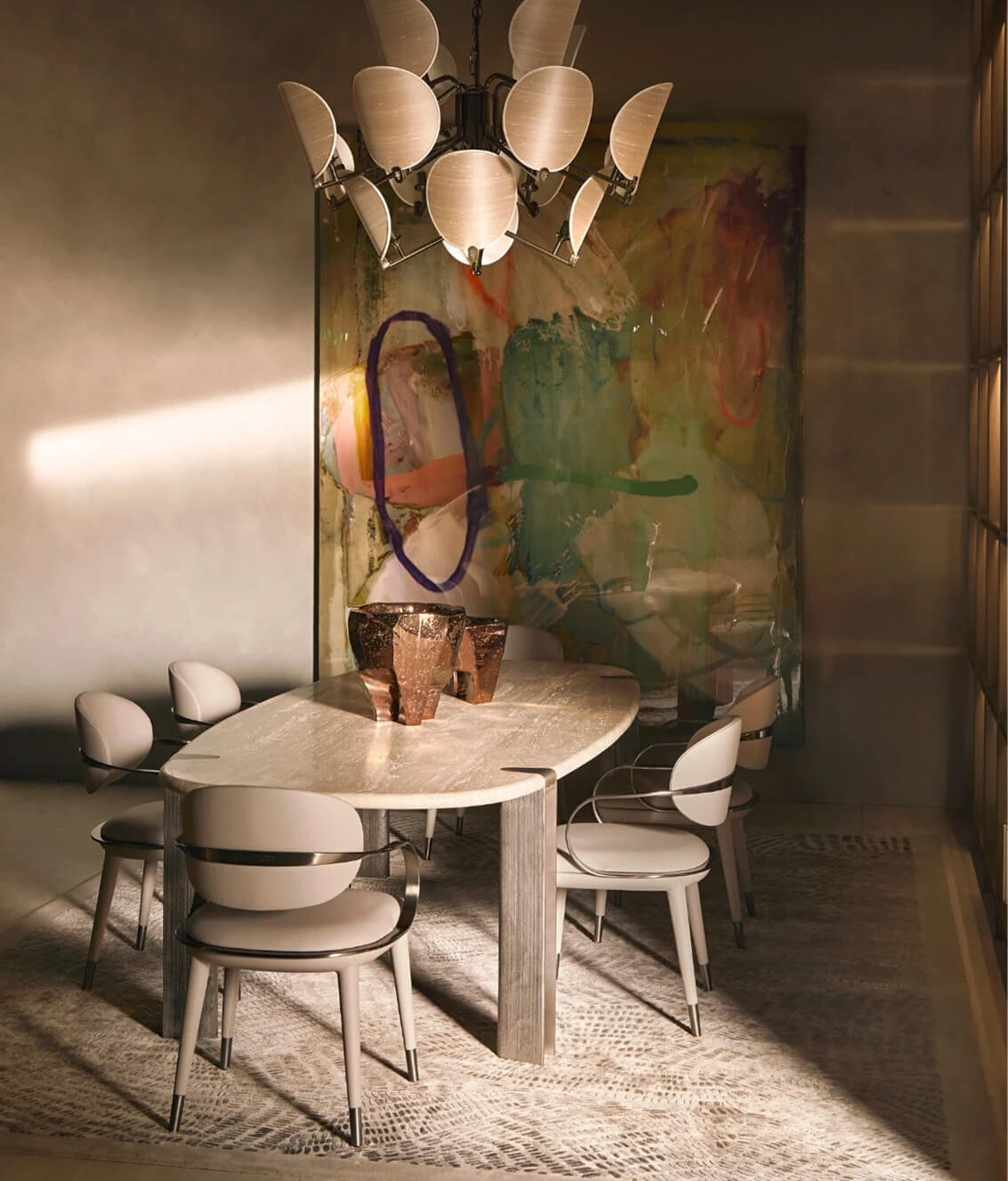 Exceptional Visionnaire Mystic table with stone surface displaying beige, cream, and gray veining plus hand-textured cast aluminum legs and matte finish