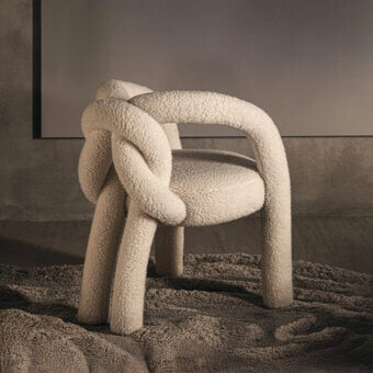 Captivating Visionnaire Shibari chair with continuous form, creamy textured stretch fabric and polyurethane core construction