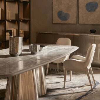 Distinguished Visionnaire Vortex table with a light marble top and satin-finished steel base crafted in a wave-like form