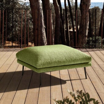 Luxury MY YOUR Piuma ottoman with textured muted green outdoor fabric upholstery and dark-toned metal base