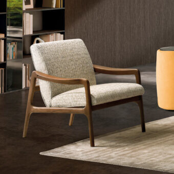 Sophisticated CTS Salotti Jack lounge chair with sage green textile upholstery and a satin Canaletto walnut frame